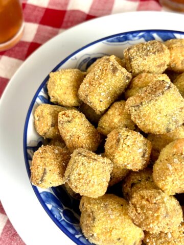 Fried okra in decorative blue bowl.