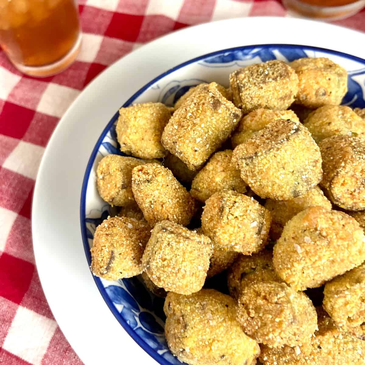 Fried okra in decorative blue bowl.