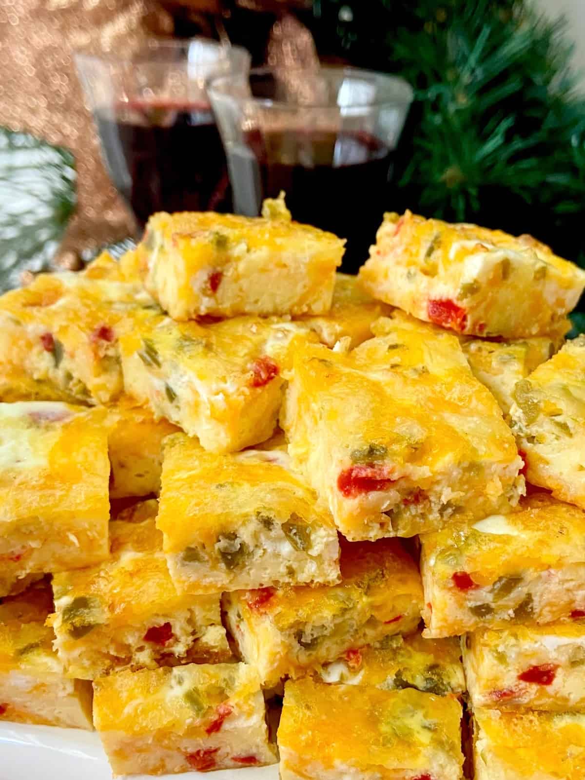 Cheesy jalapeno egg bites stacked on plate.