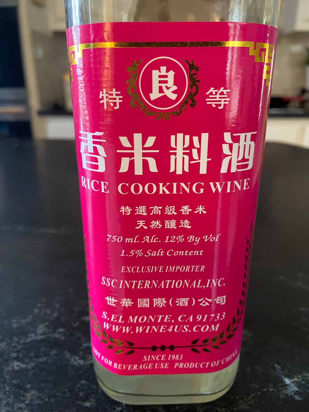 Bottle of Chinese rice cooking wine on countertop.