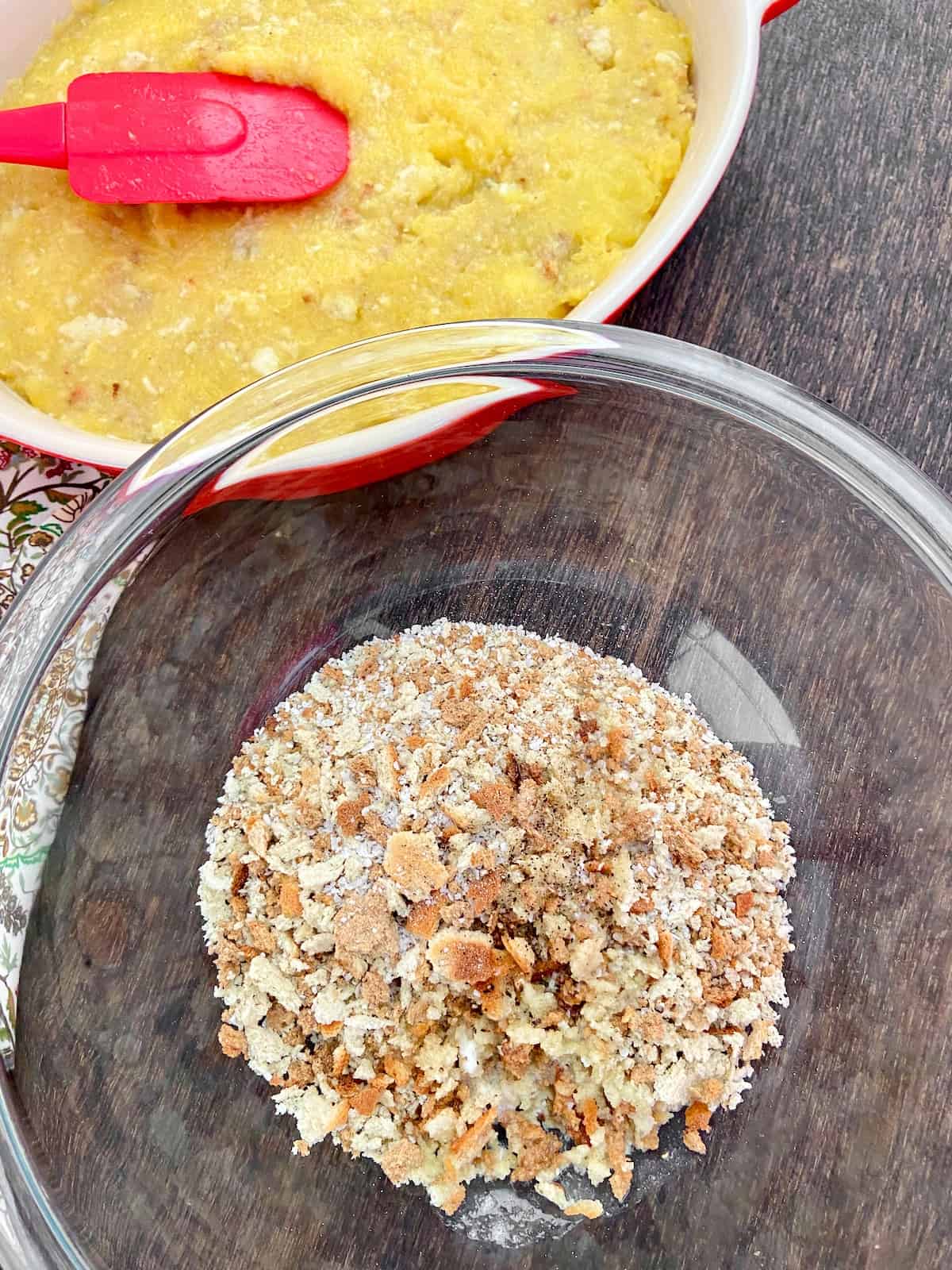 Breadcrumbs, melted butter and dried herbs in mixing bowl.