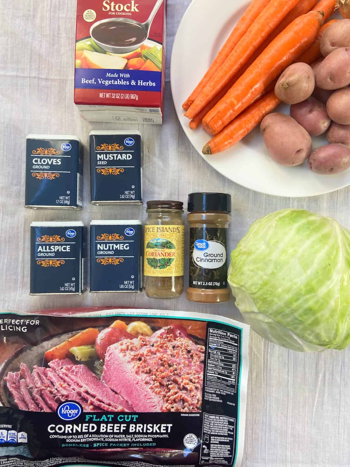 Corned Beef ingredients on white tablecloth.