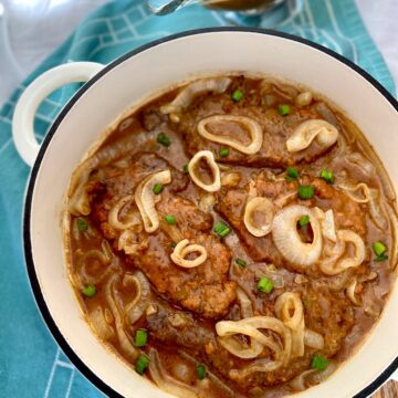 Liver and onions in white dutch oven.