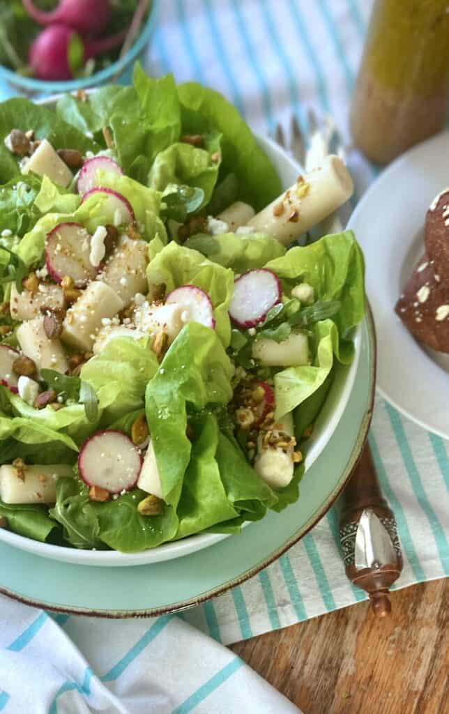 Hearts of palm salad in white bowl.
