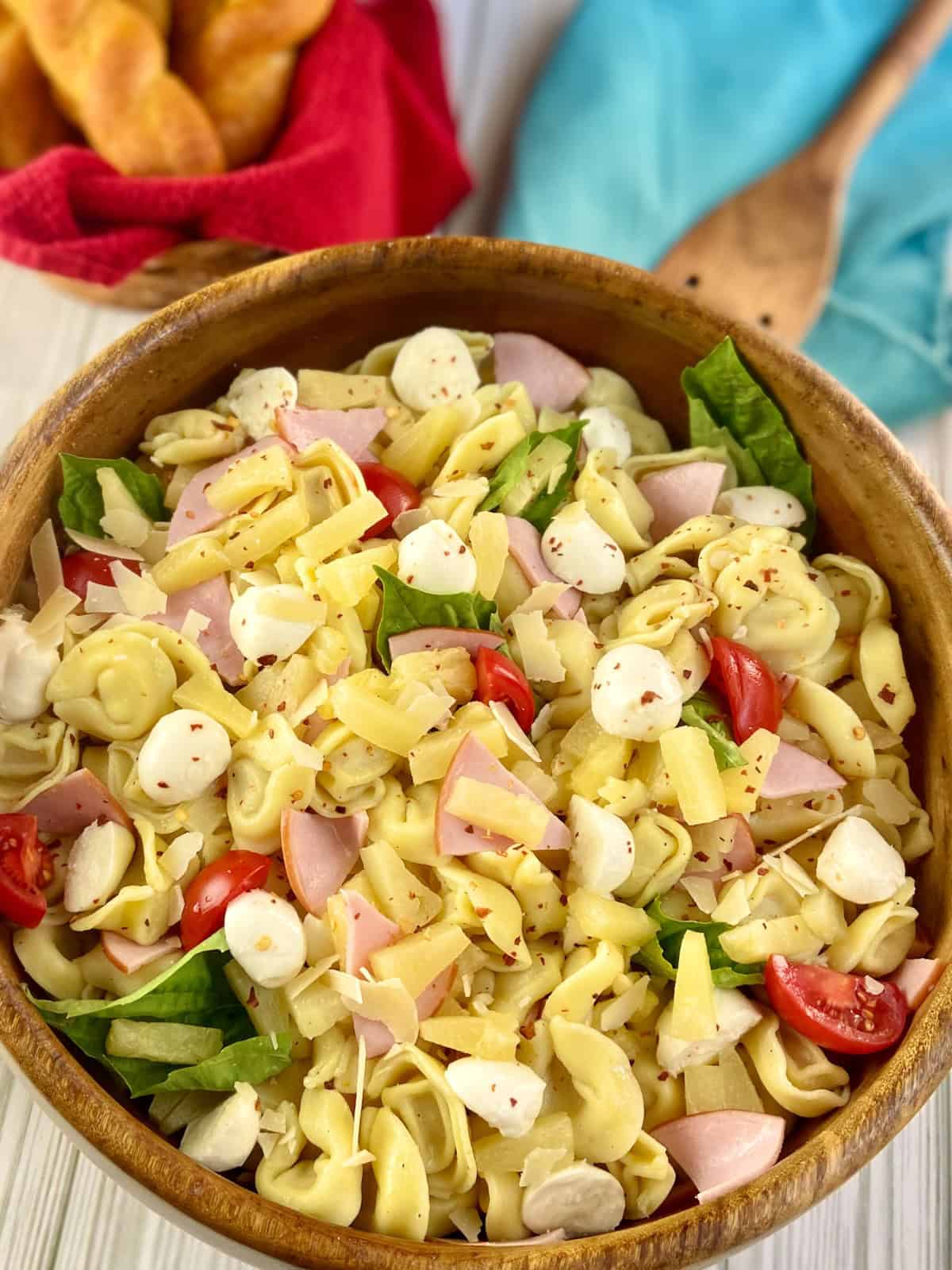 Hawaiian pasta salad in wooden serving bowl.