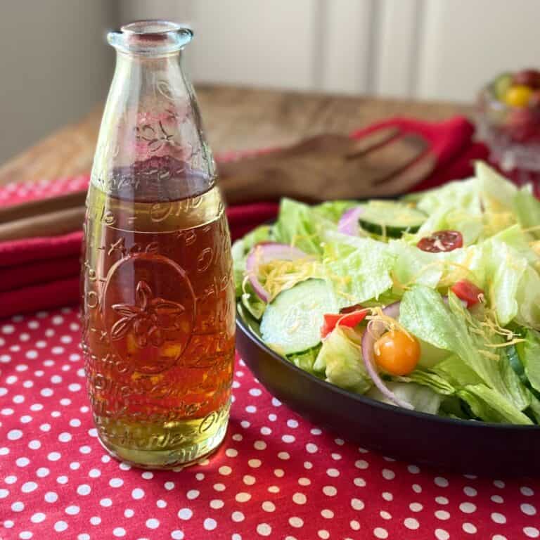 Sweet and tangy salad dressing in a decorative oil dispenser.