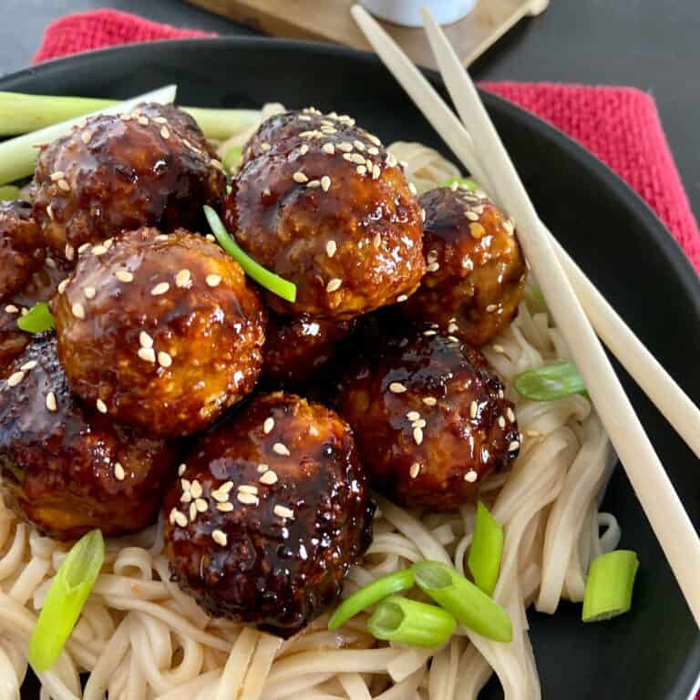 Asian Chicken Meatballs over Pad Thai noodles.