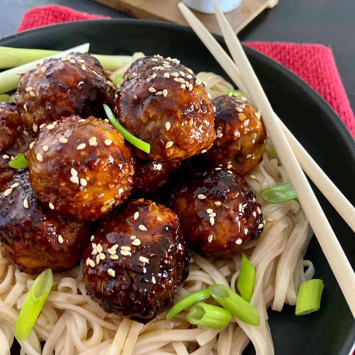 Asian Chicken Meatballs over Pad Thai noodles.