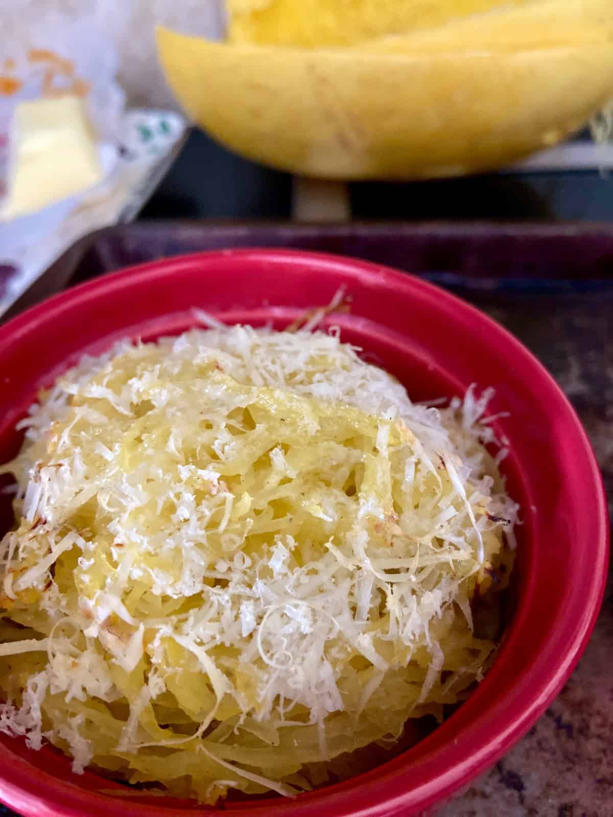 Spaghetti squash in red ramekin.