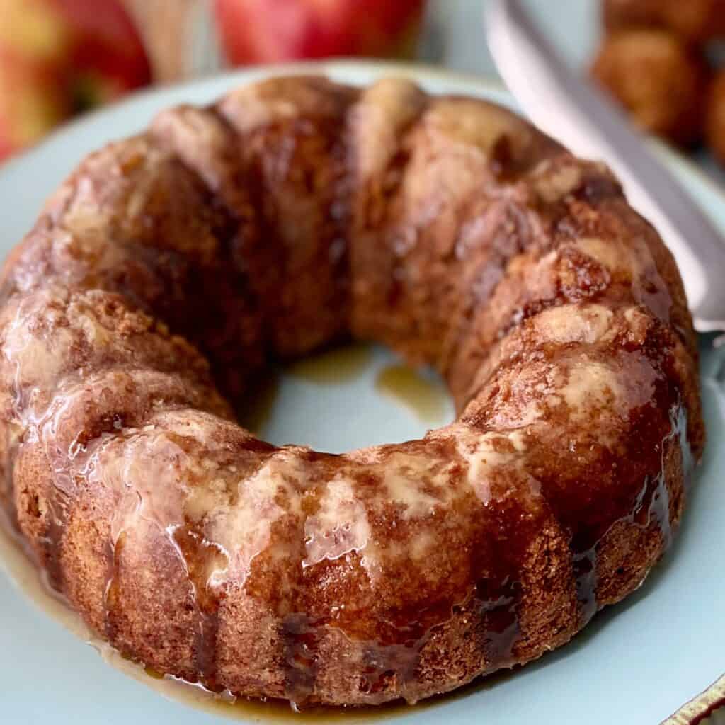Apple Bundt cake on turquoise platter.