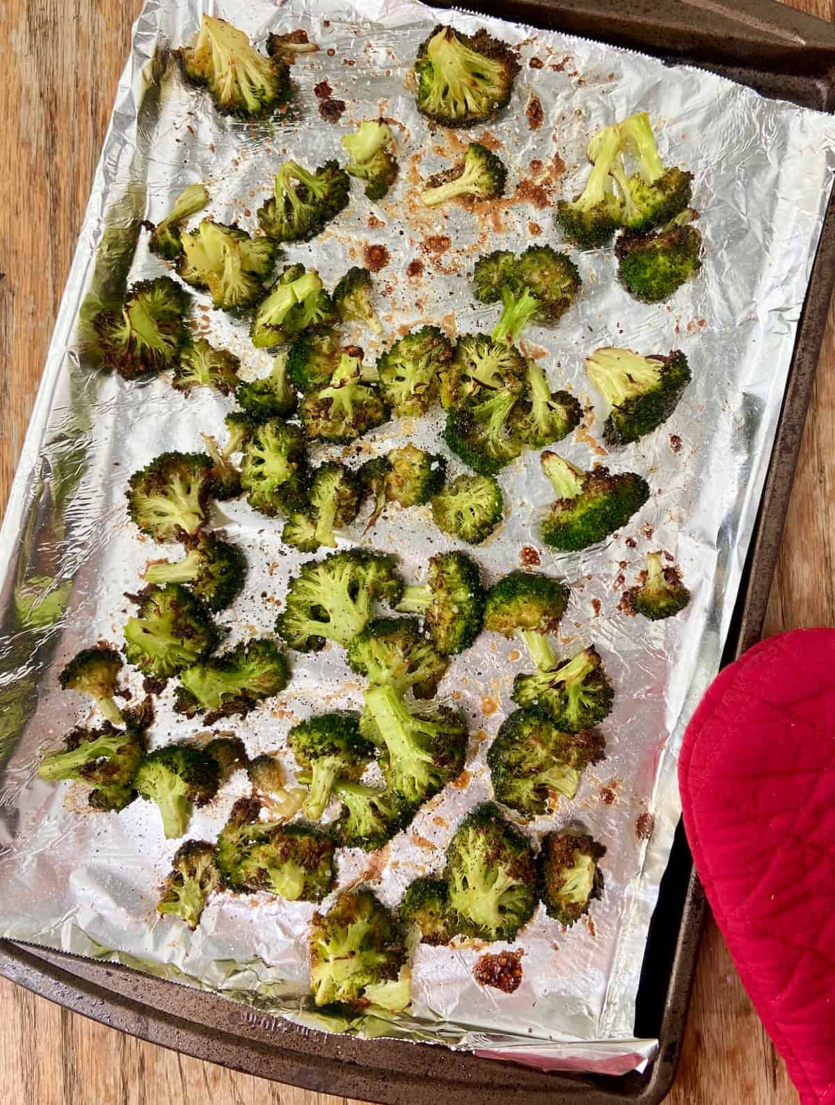 Broccoli on foil lined baking sheet.