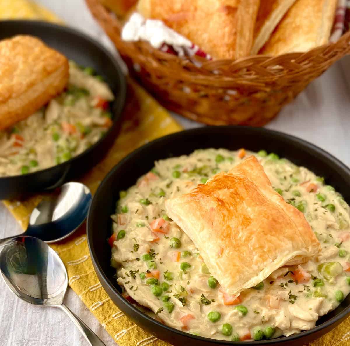 Chicken soup topped with puff pastry.