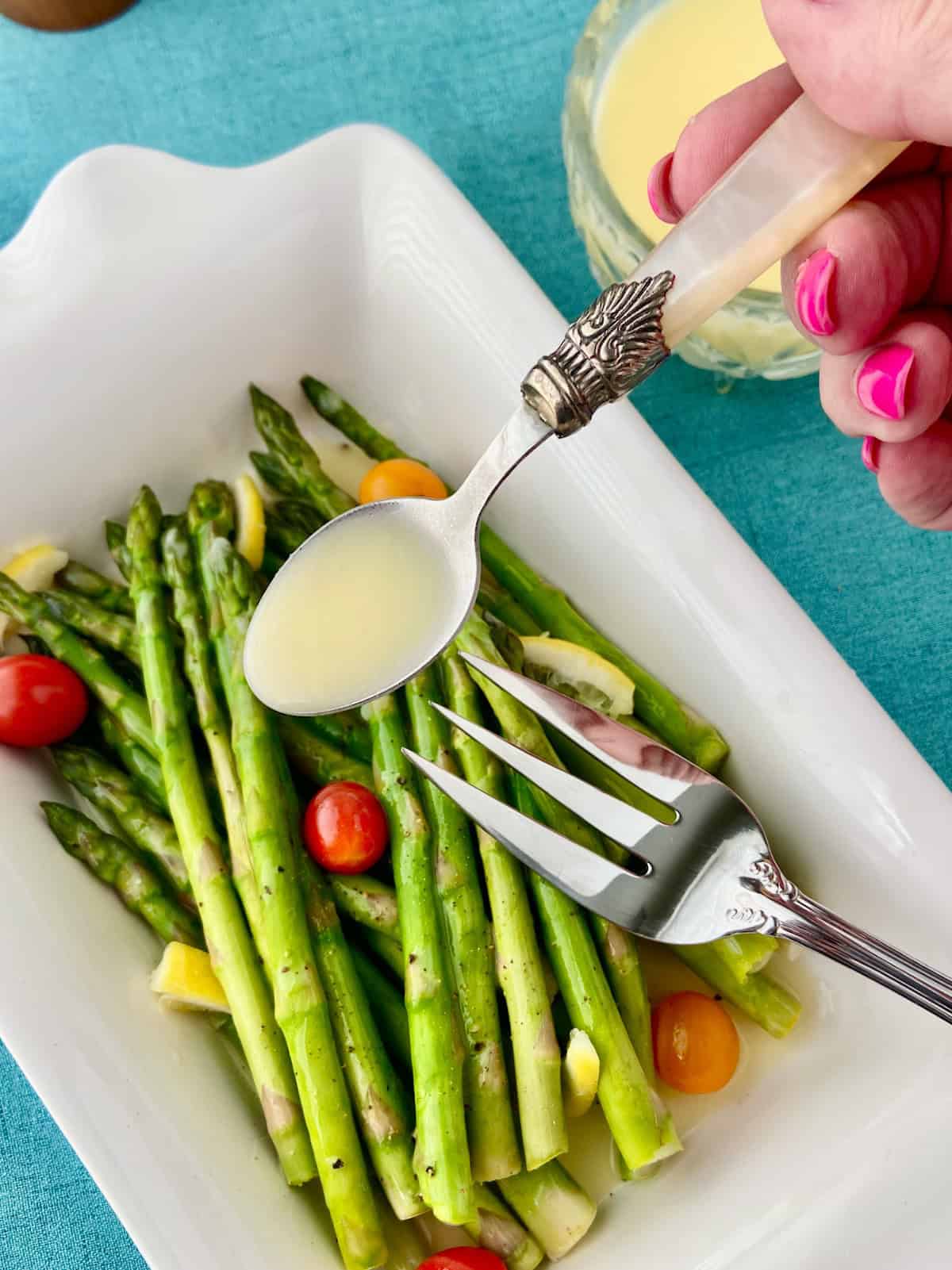 Lemon butter sauce on serving spoon.