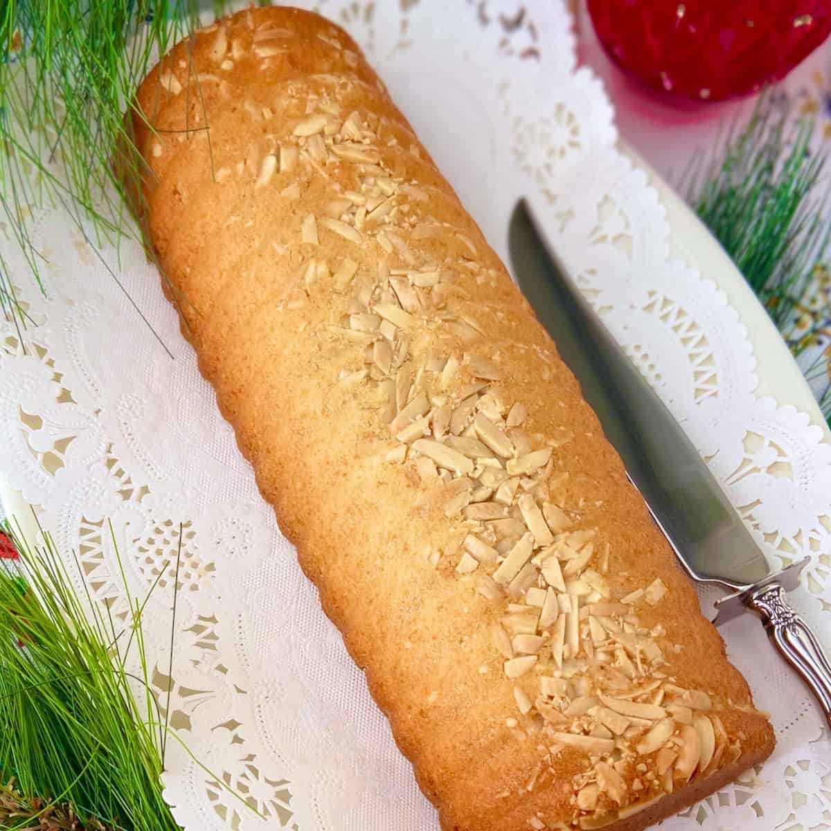 Scandinavian Almond Cake on white serving platter.