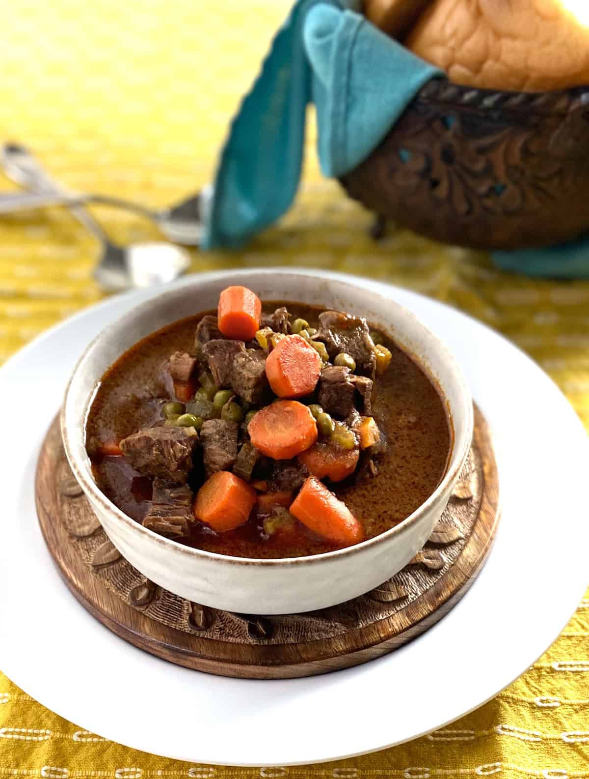 Beef stew in white bowl.