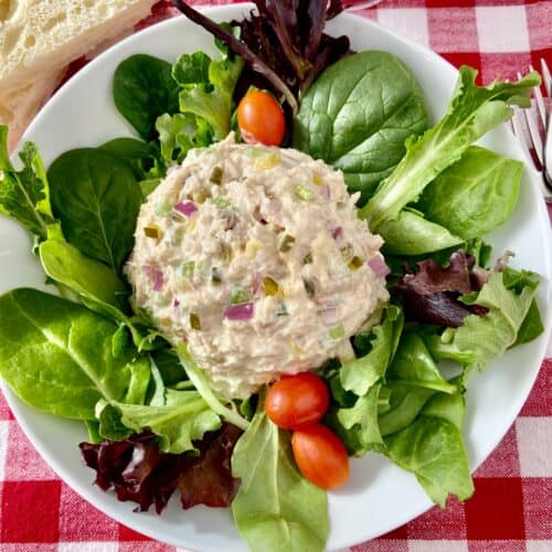 Tuna salad on a bed of mixed greens with grape tomatoes.