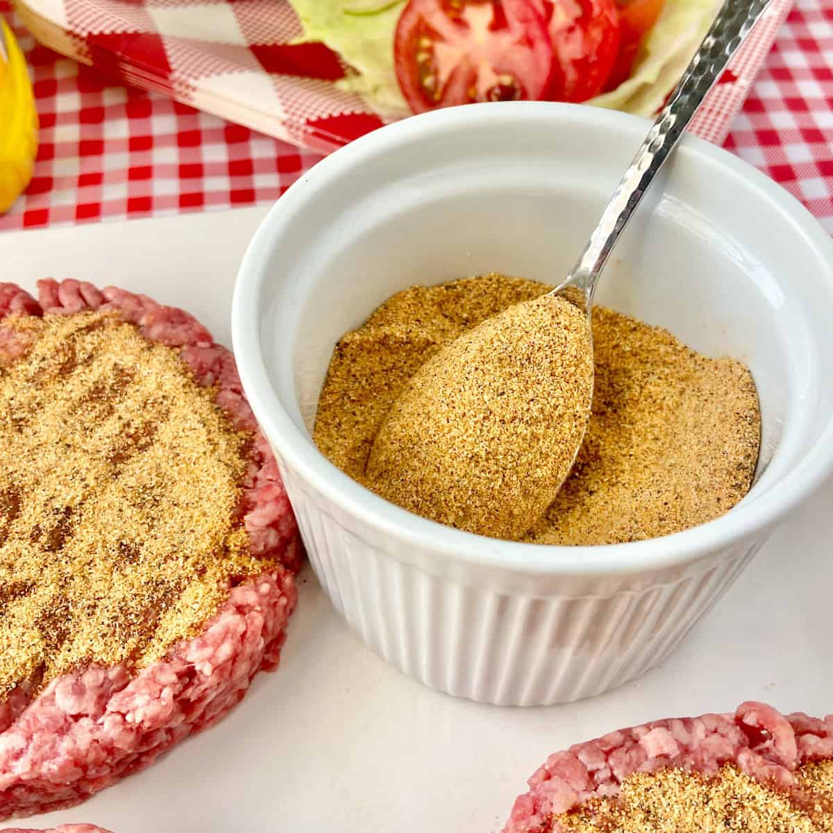 Spoon in dry hamburger seasoning mix.