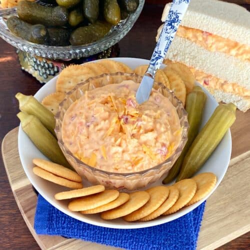Southern pimento cheese in crystal bowl with spreader.