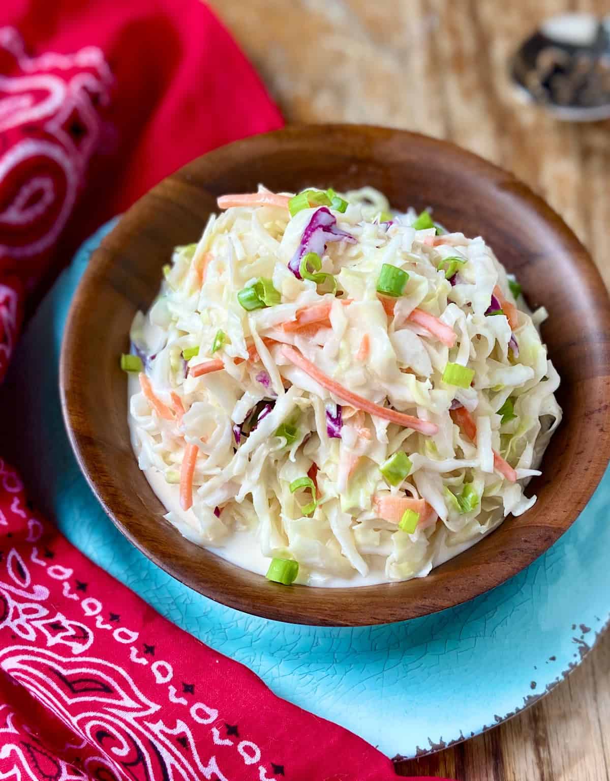 Creamy Texas Coleslaw in a wooden serving bowl.