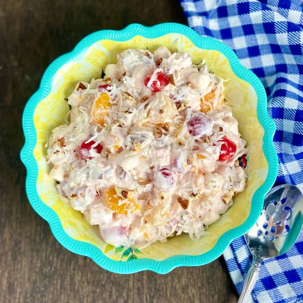Ambrosia fruit salad in decorative serving bowl.