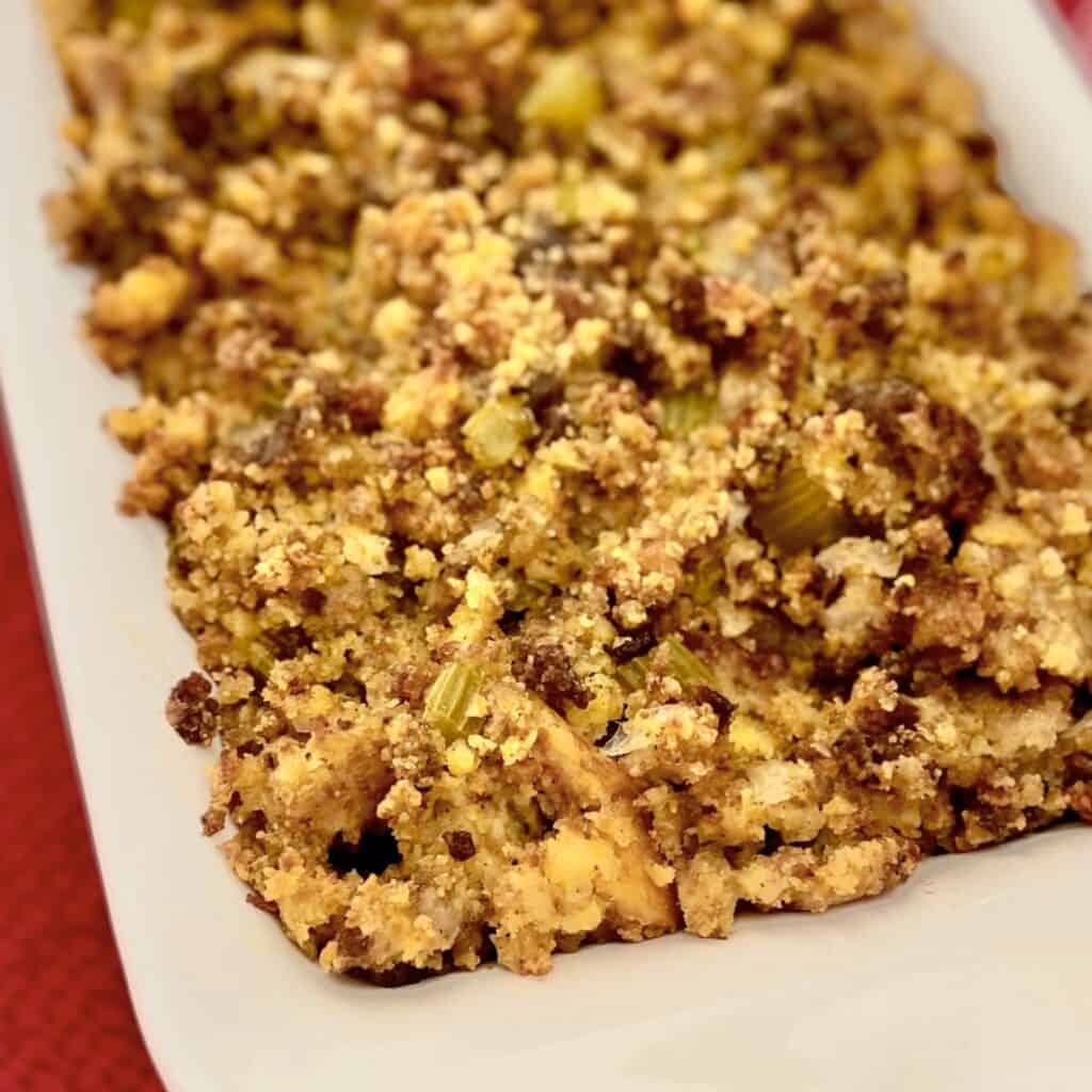 Southern Cornbread Dressing in white casserole dish.