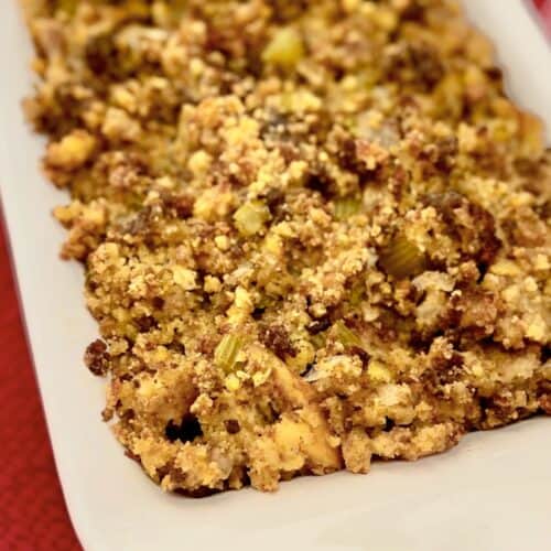Southern Cornbread Dressing in white casserole dish.
