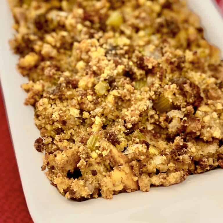 Southern Cornbread Dressing in white casserole dish.