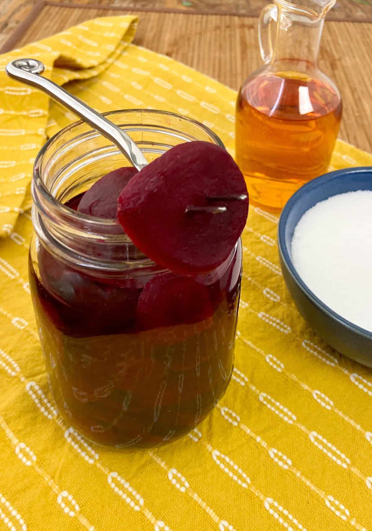 Pickled beets in a mason jar.