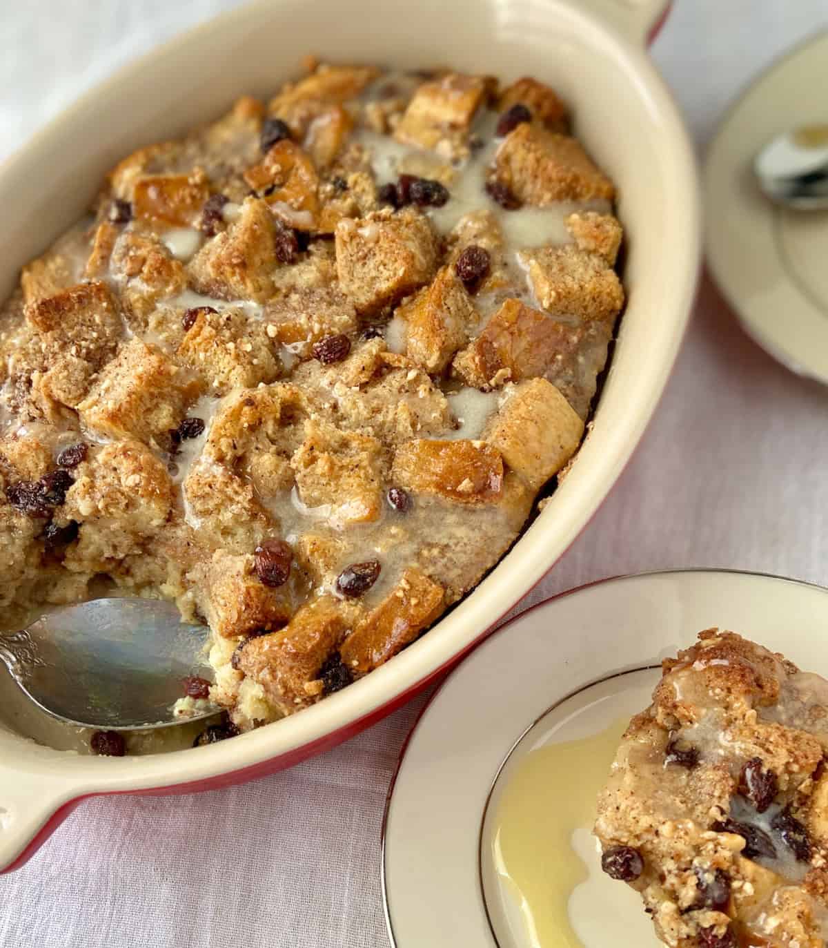 Bread Pudding in baking dish with serving spoon.