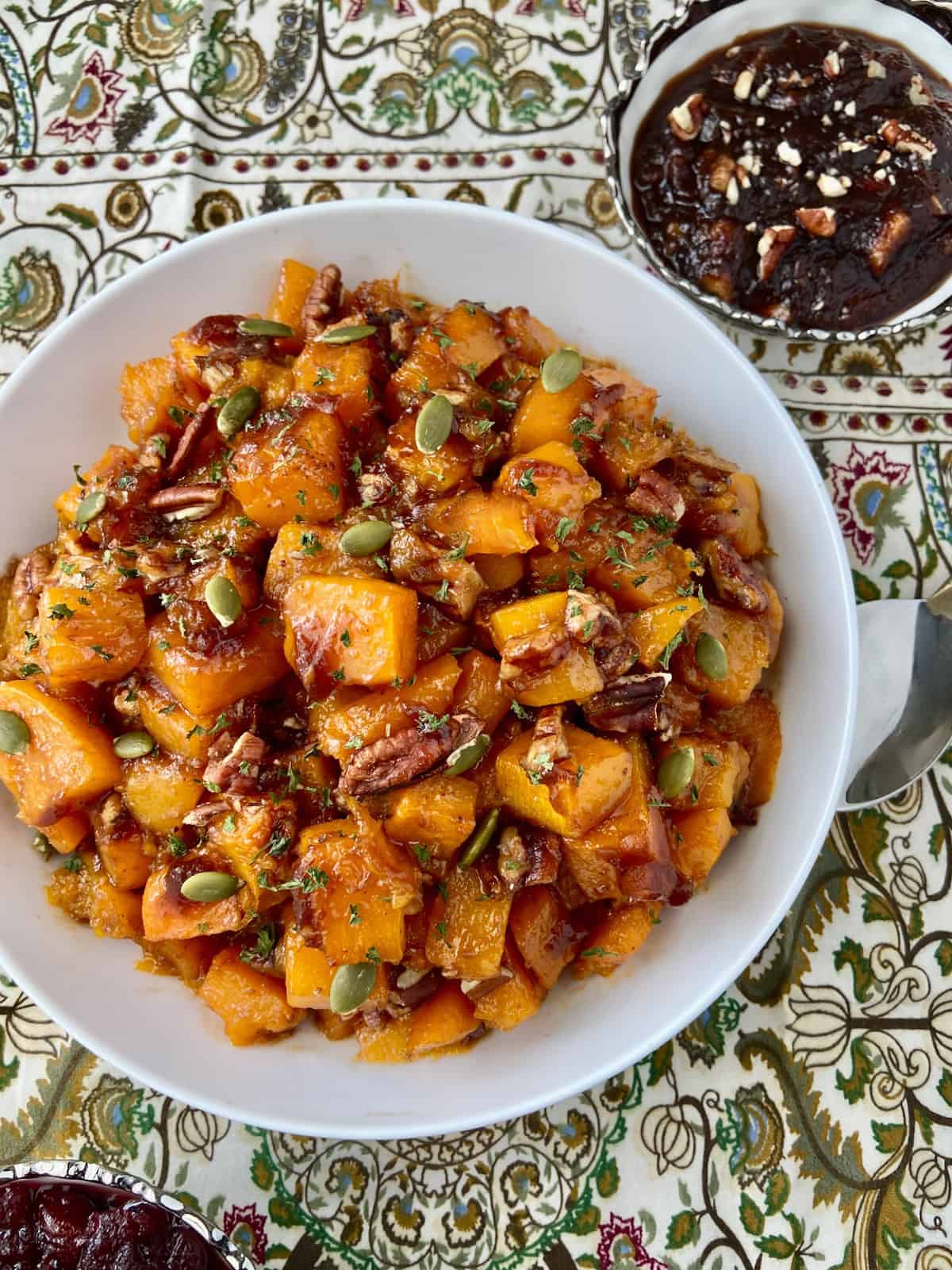 Roasted butternut squash in white serving bowl.