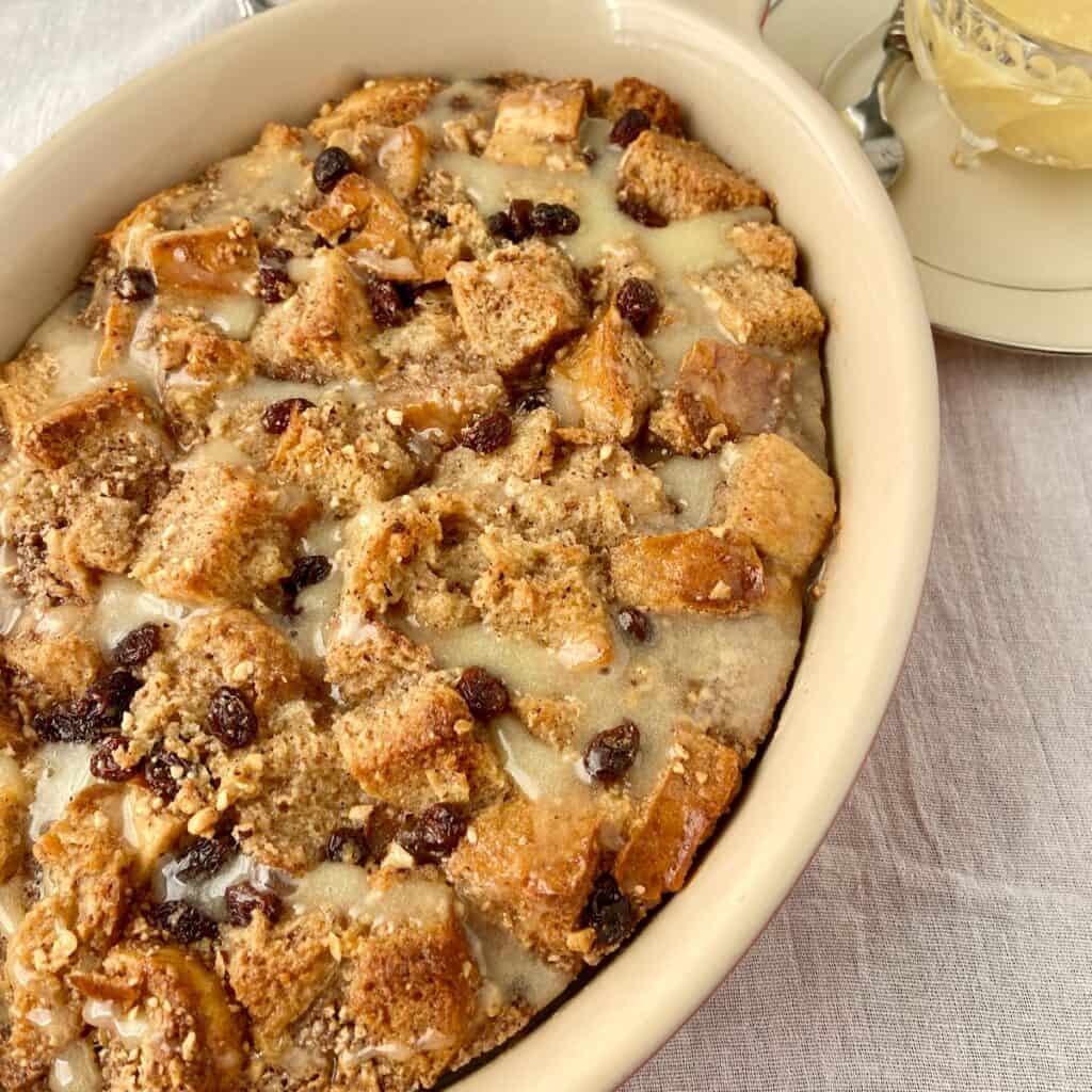Bread Pudding with bourbon sauce in baking dish.