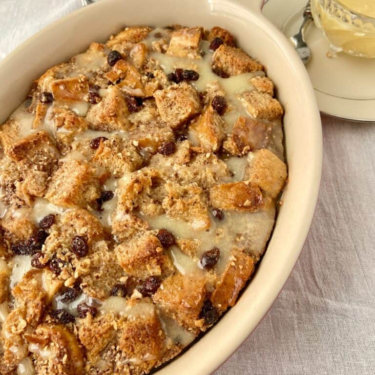Bread Pudding with bourbon sauce in baking dish.