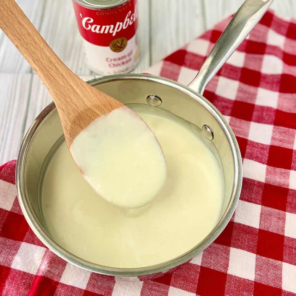 Condensed cream of chicken soup in saucepan.