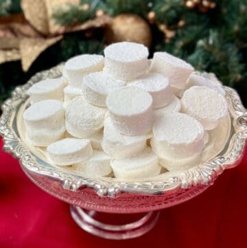 Marshmallows stacked on a silver serving tray.