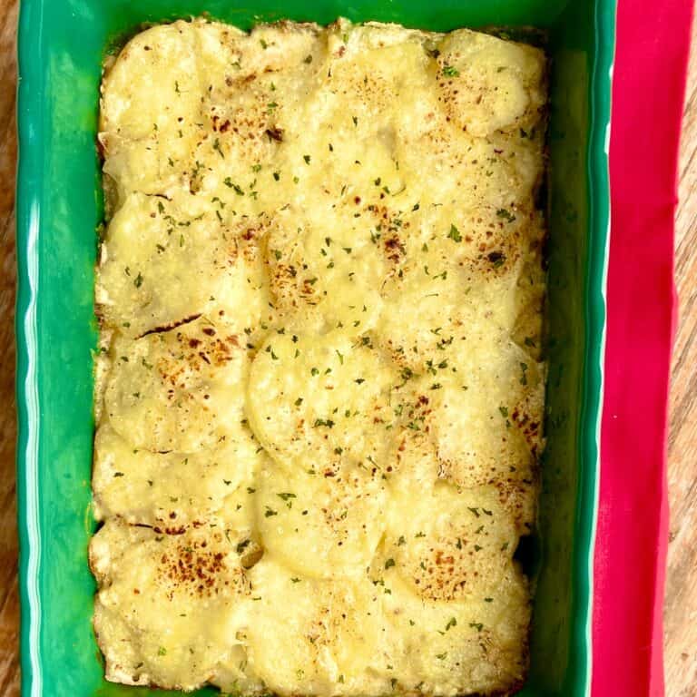 Scalloped Potatoes in casserole dish.