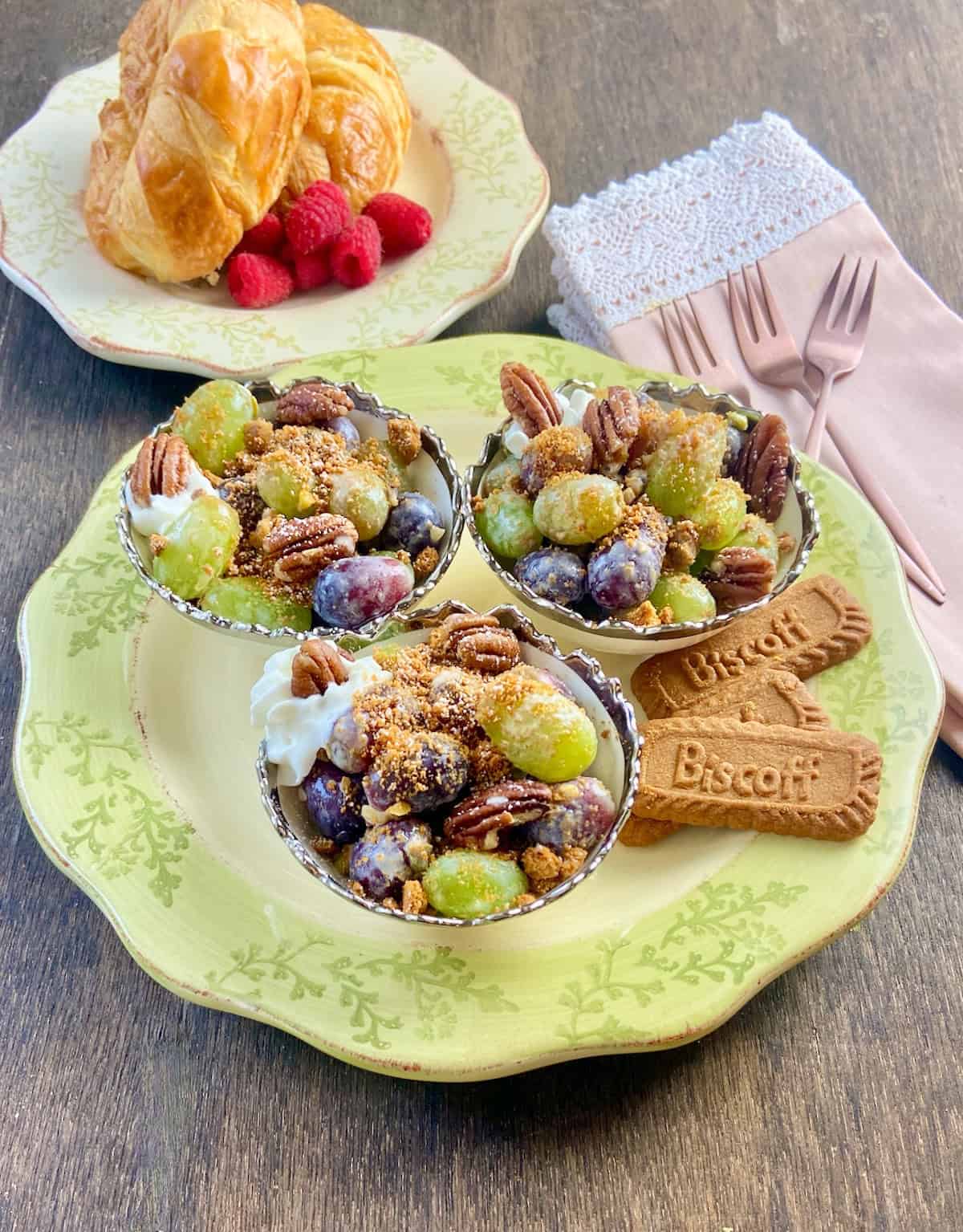 Three bowls of Southern Grape Salad on a vintage serving platter.