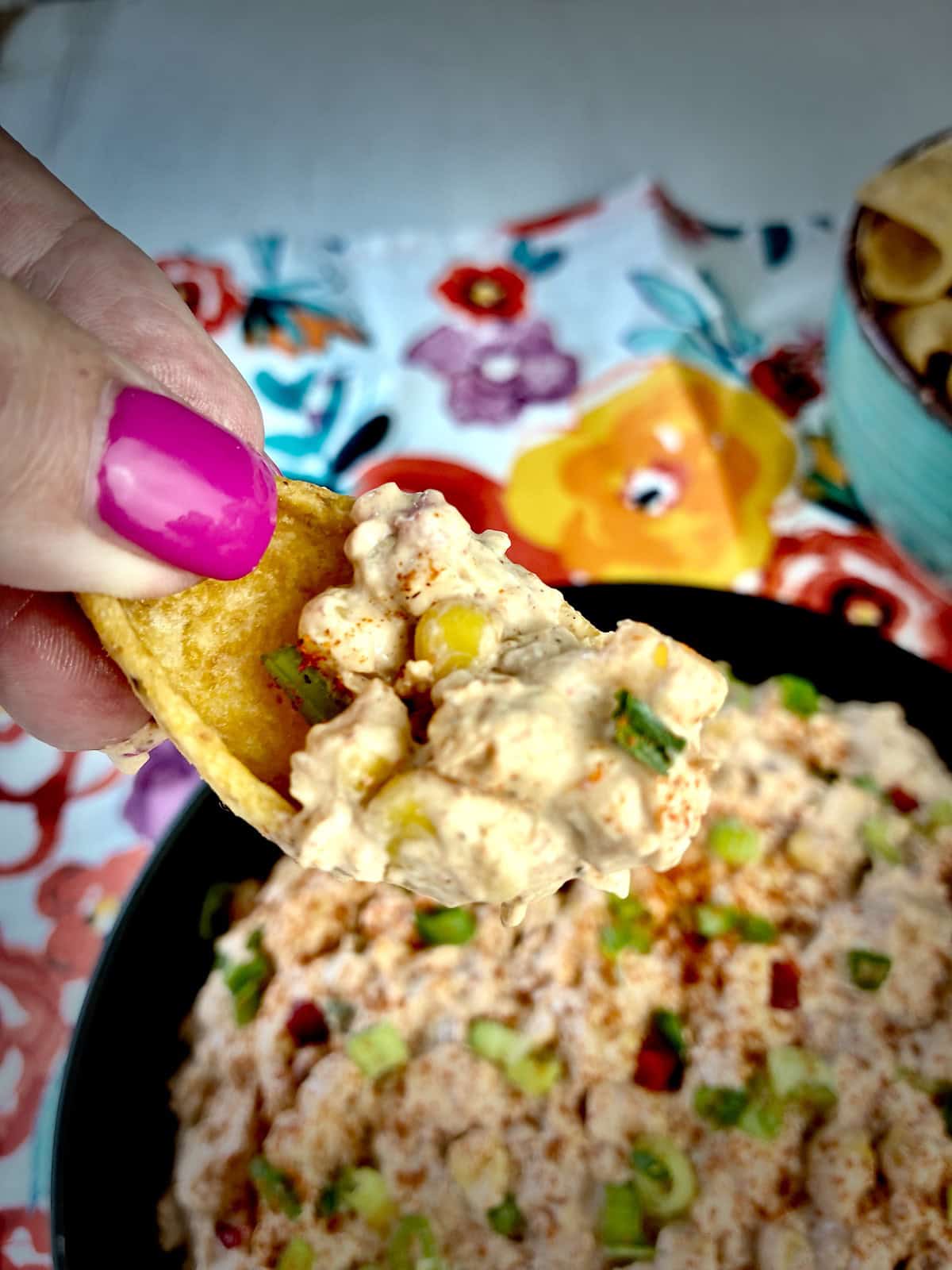 Corn dip on scoop chip.