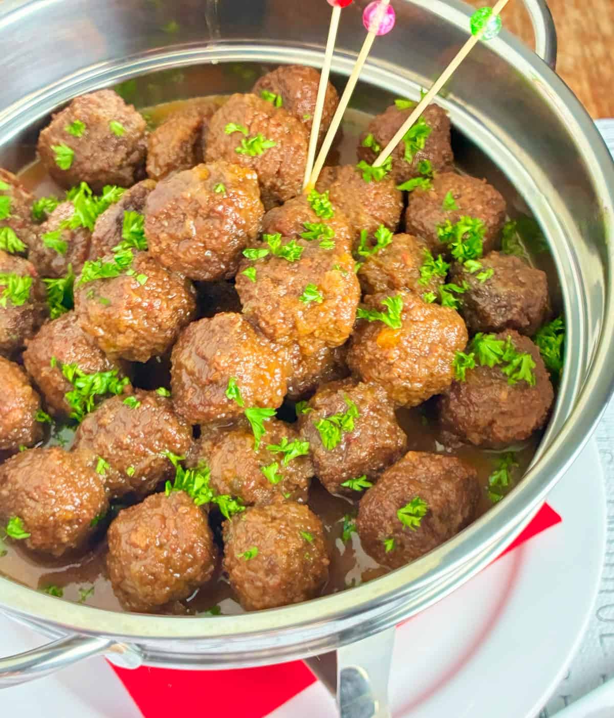 Close up image of meatballs in Jezebel sauce.
