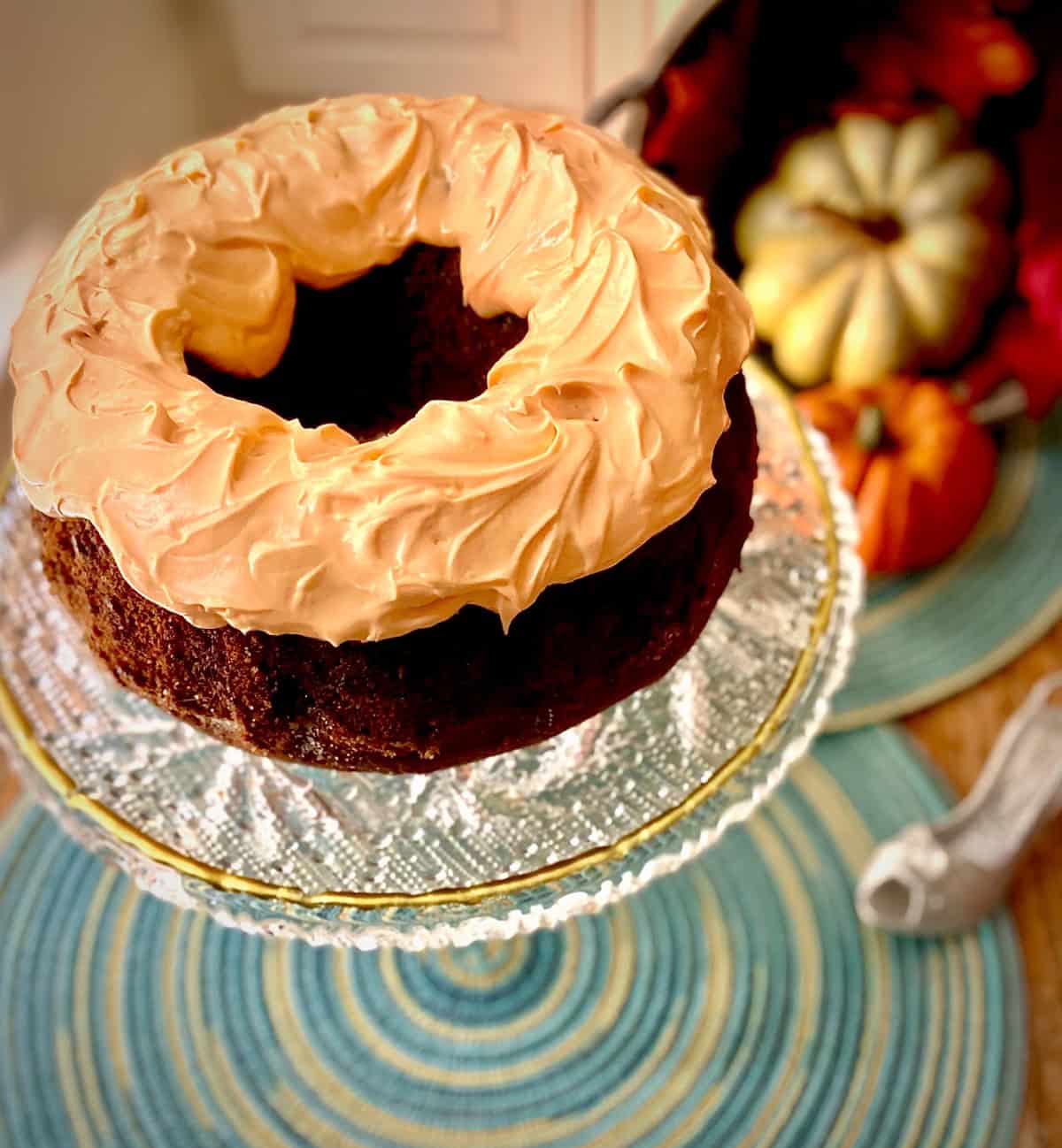 Pumpkin Bundt Cake on crystal cake pedastal.
