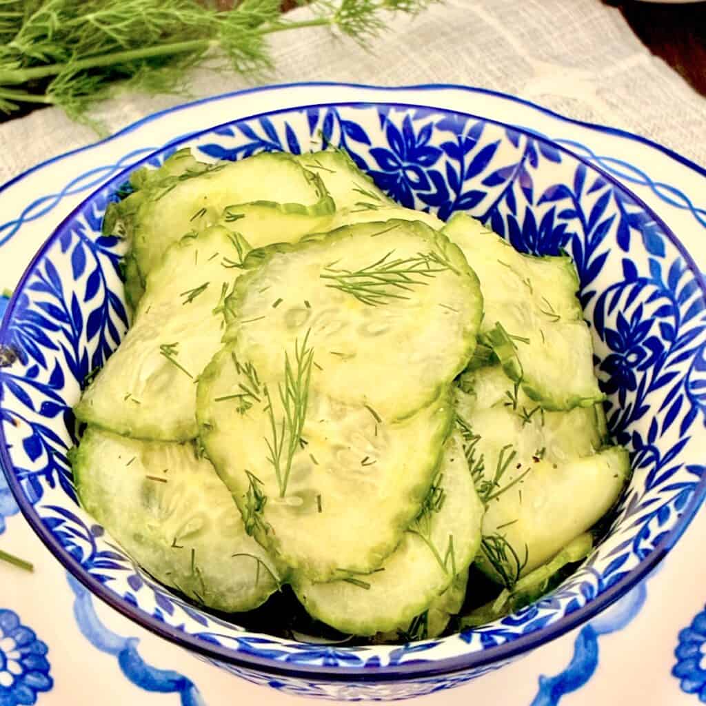 Austrian Cucumber Salad in decorative blue and white serving bowl.