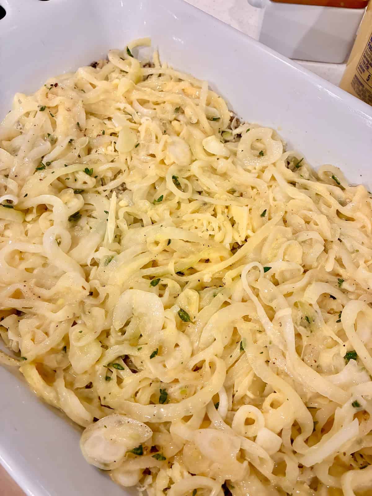 Layer top of casserole with remaining onions.
