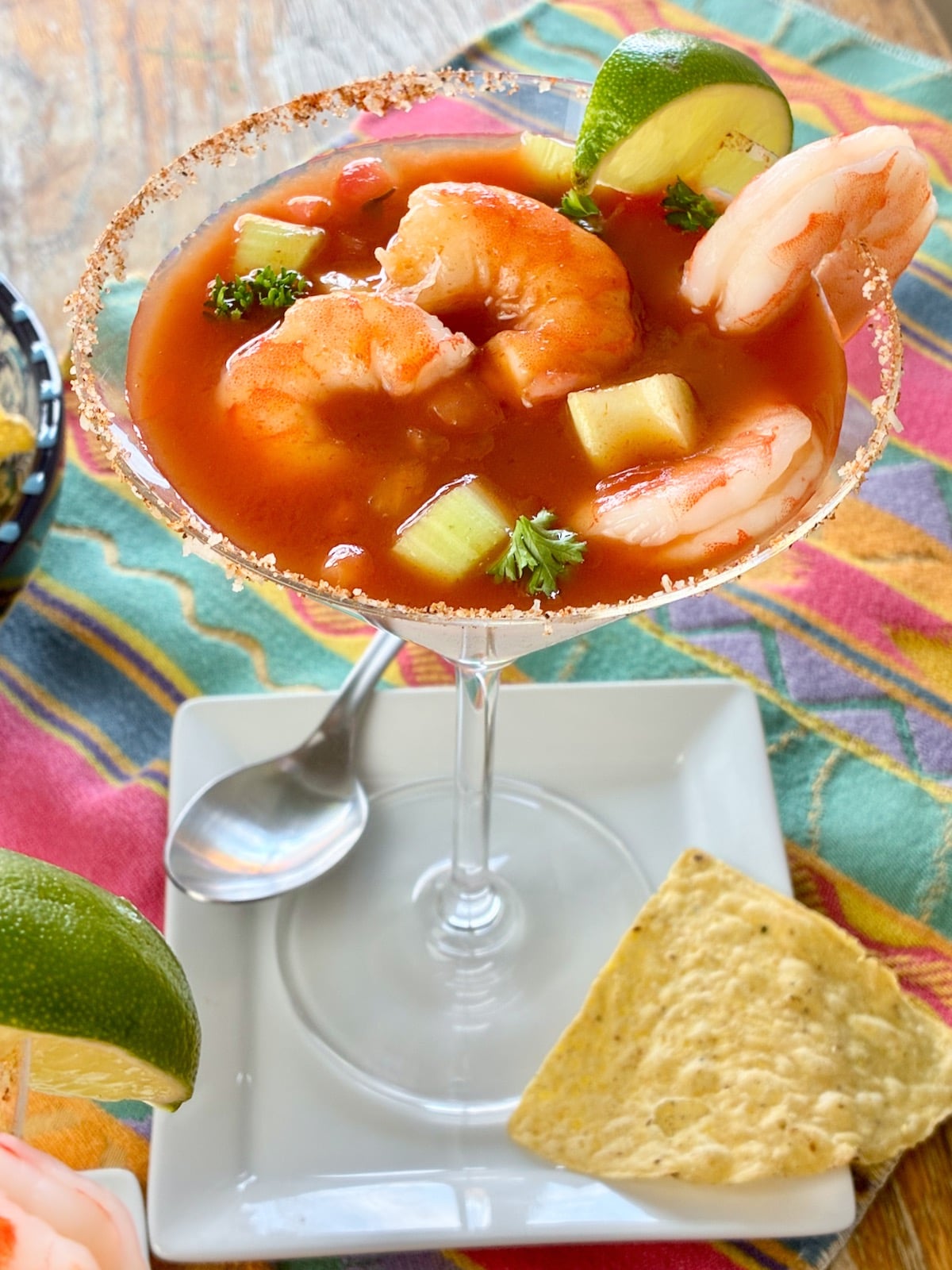 Mexican Shrimp Cocktail in martini glass with wedge of lime.
